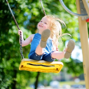 Little girl on swing